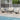Outdoor Metal 4-Person Patio Set With Two Tables and Wicker Decor
