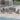 Outdoor Metal 7-Person Patio Set With Two Tables And Cushions